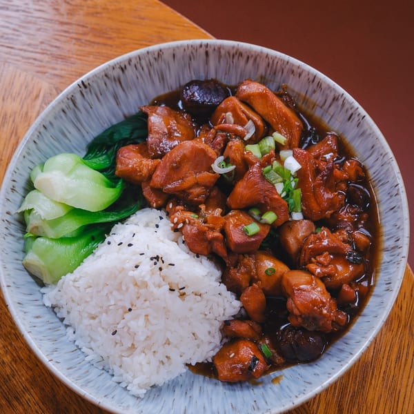 Reren Lamen n Bar's chicken and mushroom dish with white rice and bok choy.